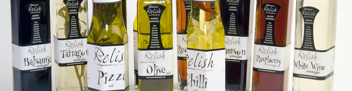 Image of a collection of Relish bottles with printed labels